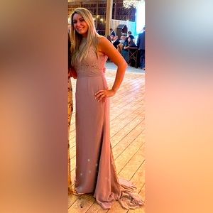 Long high neck dress with a train.